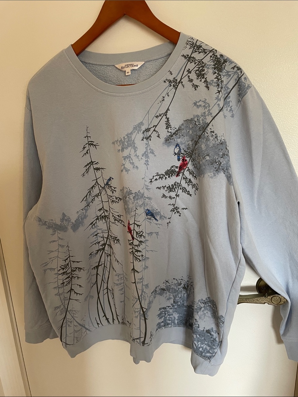 Northern Reflections Light Blue Crewneck Sweatshirt with Tree & Bird Motif
